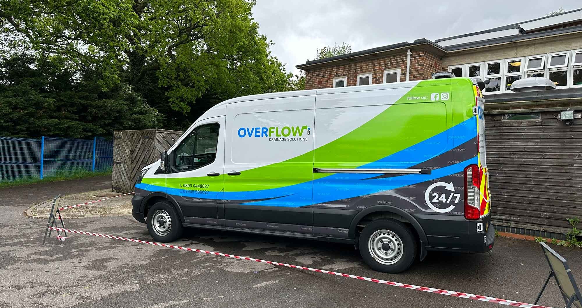 Overflow 24/7 emergency plumbing and drainage van signage — side profile